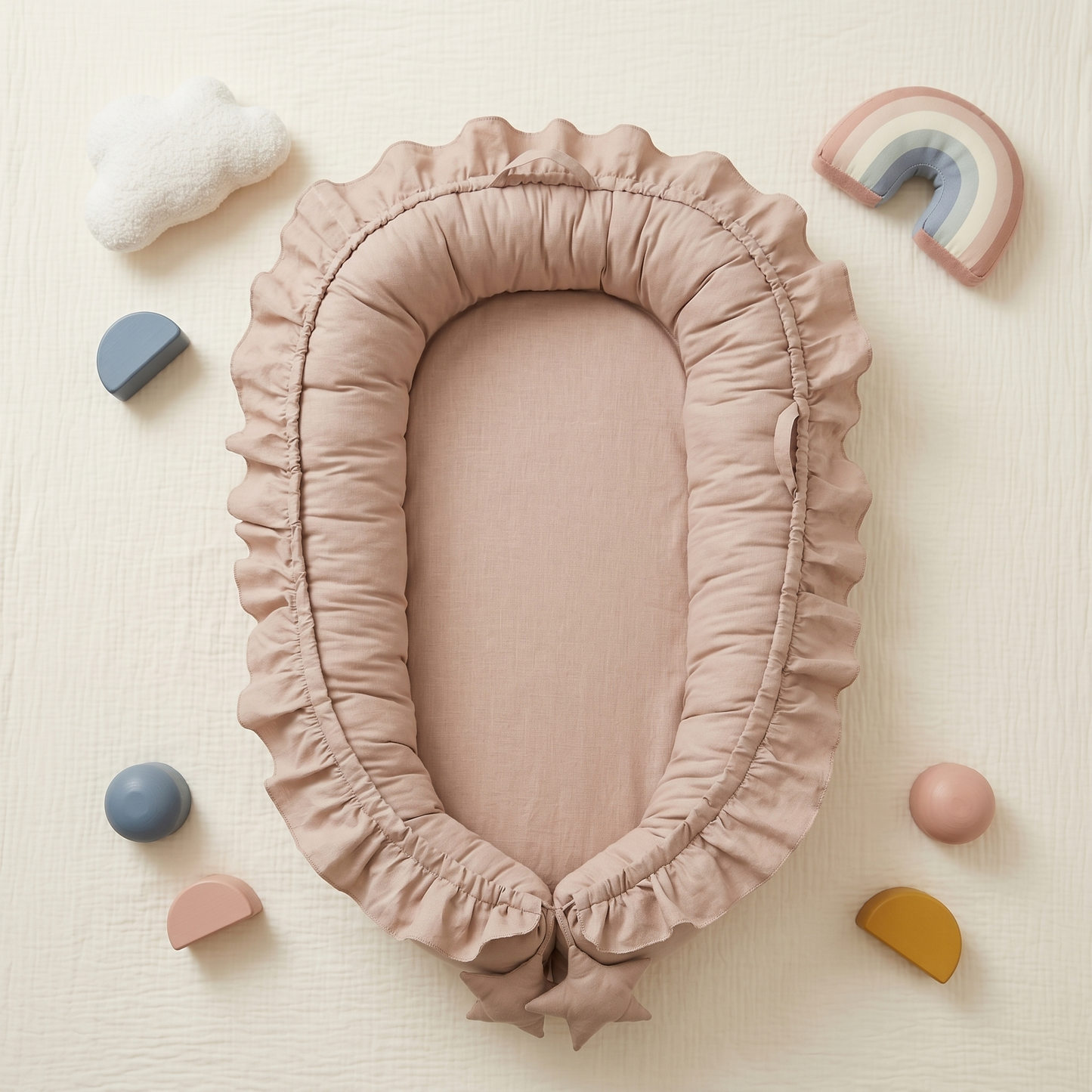 Snug baby nest lounger, apricot, styled flat lay